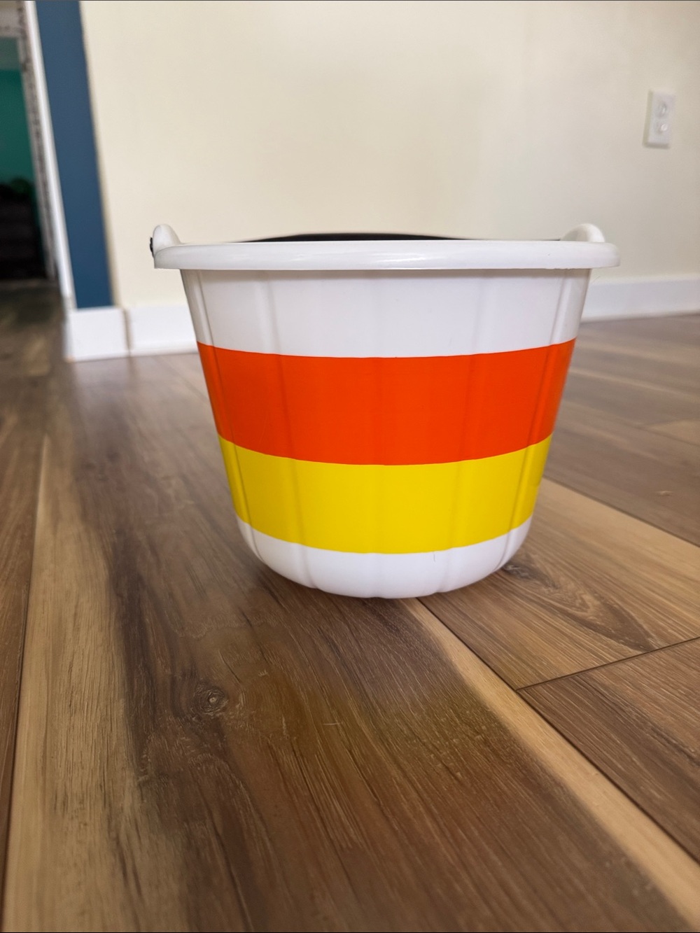 White Plastic Accent Planter with Orange and Yellow Stripes